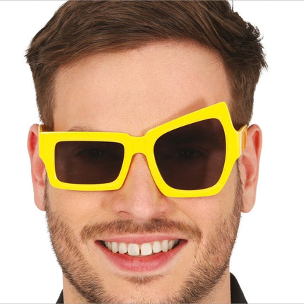 Gele Bril Asymmetrisch van Fiestas Guirca koop je bij Partywinkel