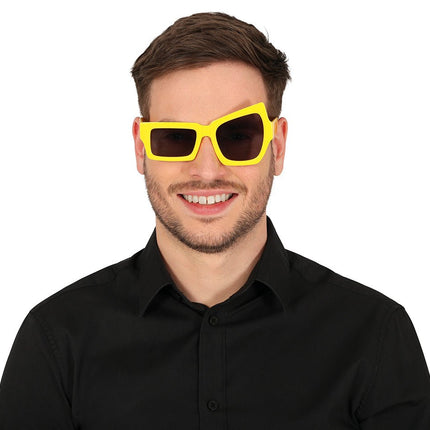 Gele Bril Asymmetrisch van Fiestas Guirca koop je bij Partywinkel